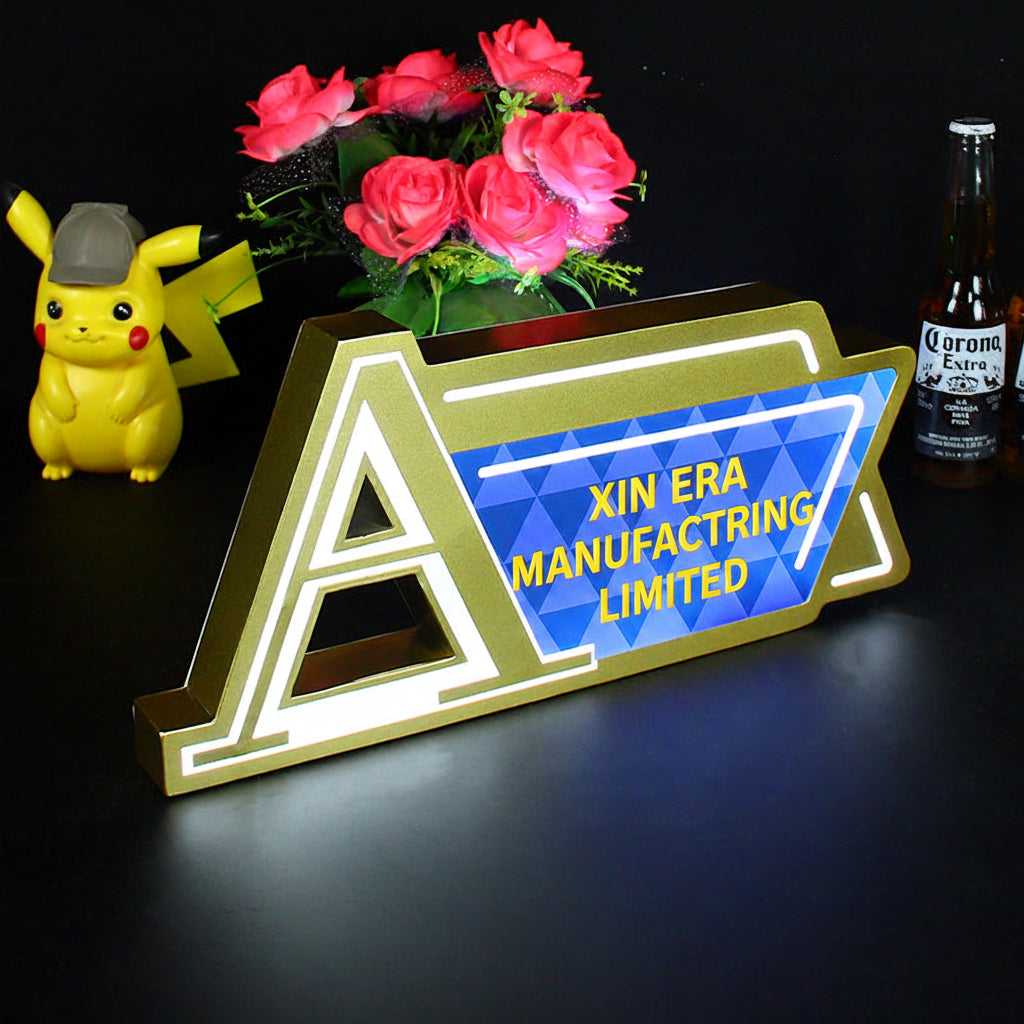 Custom gold metal LED counter sign with Augerta branding and blue geometric pattern