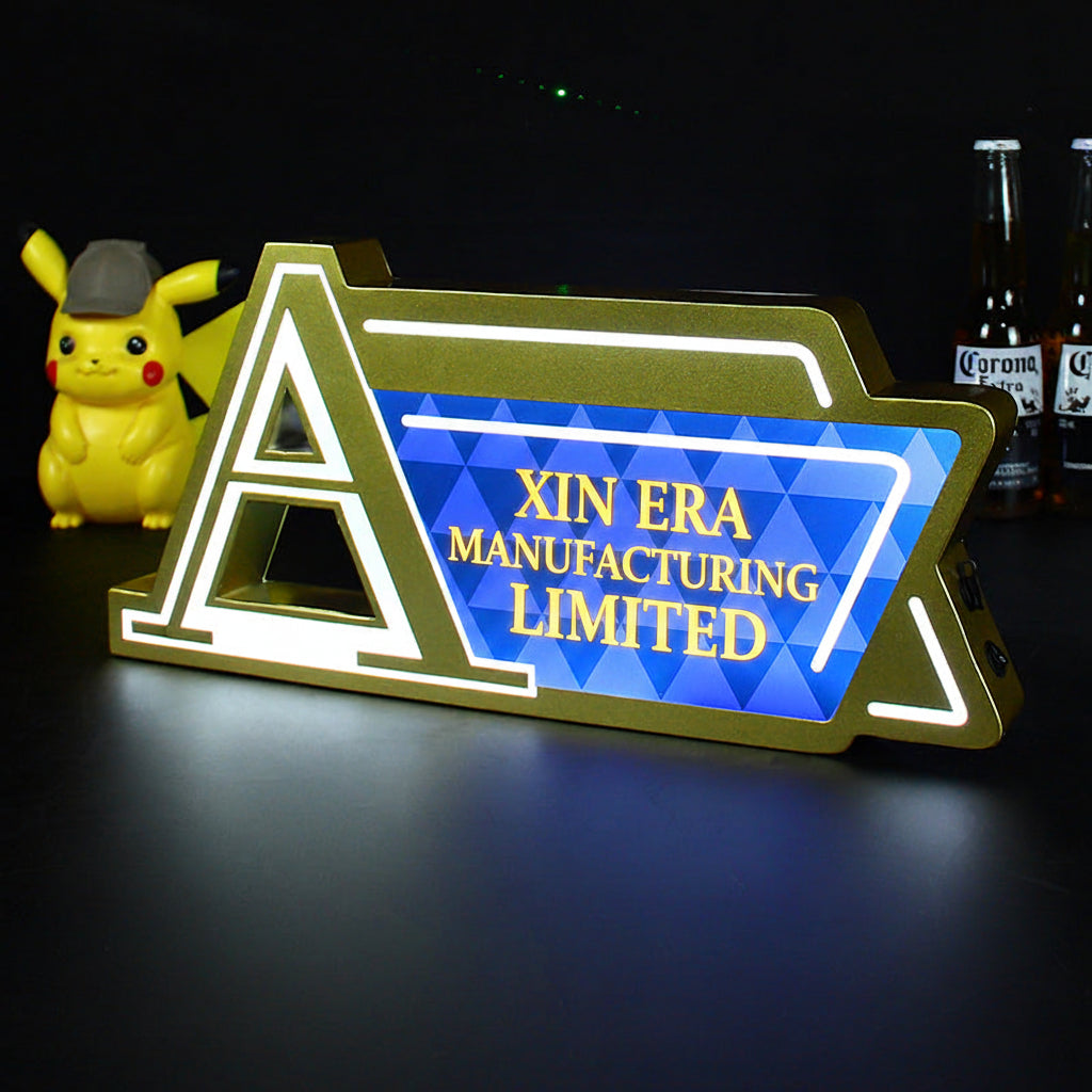 Custom gold metal LED counter sign with Augerta branding and blue geometric pattern
