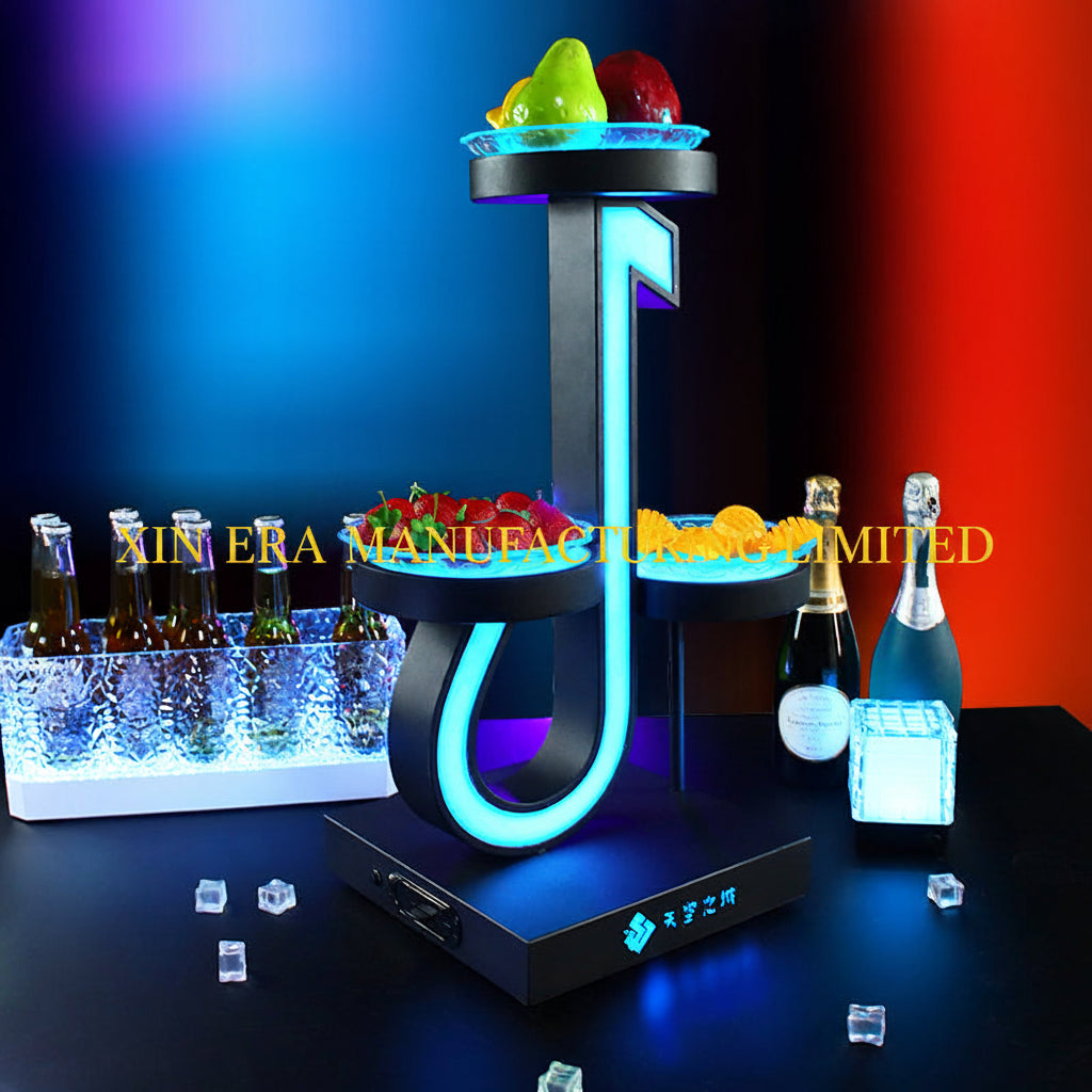Luminous music note shaped snack tray with RGB LED lighting in a dark VIP lounge setting.