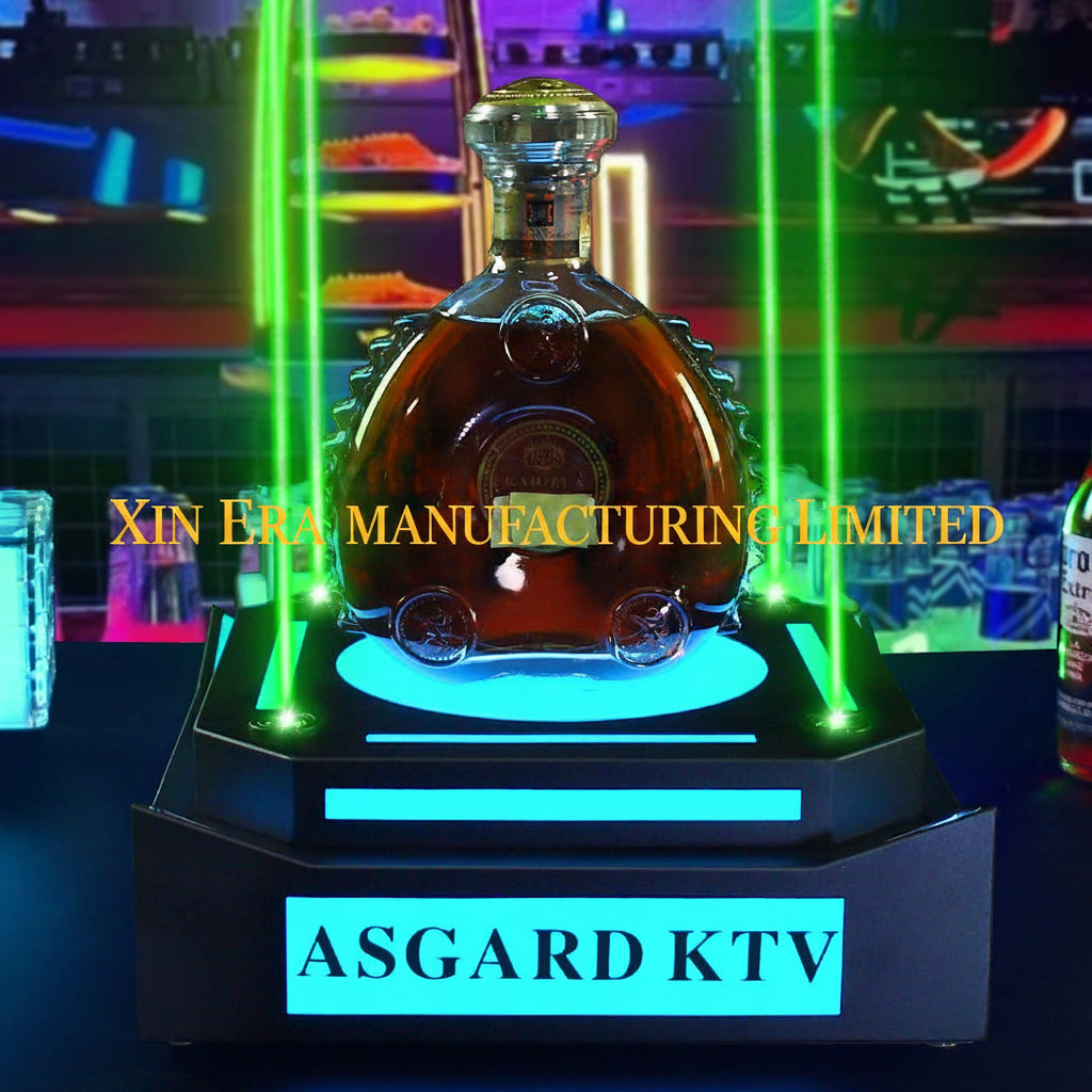 Front view of XIN ERA LED VIP bottle presenter with glowing logo on a dark nightclub background.