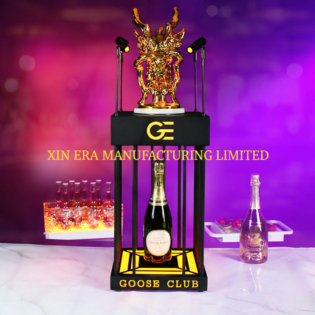 Luxury gold dragon totem on LED illuminated bottle presenter.