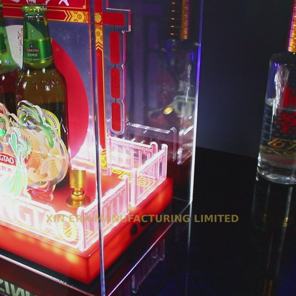 Custom festive red LED brand display pedestal with traditional Chinese architectural motifs and illuminated base for commercial events.