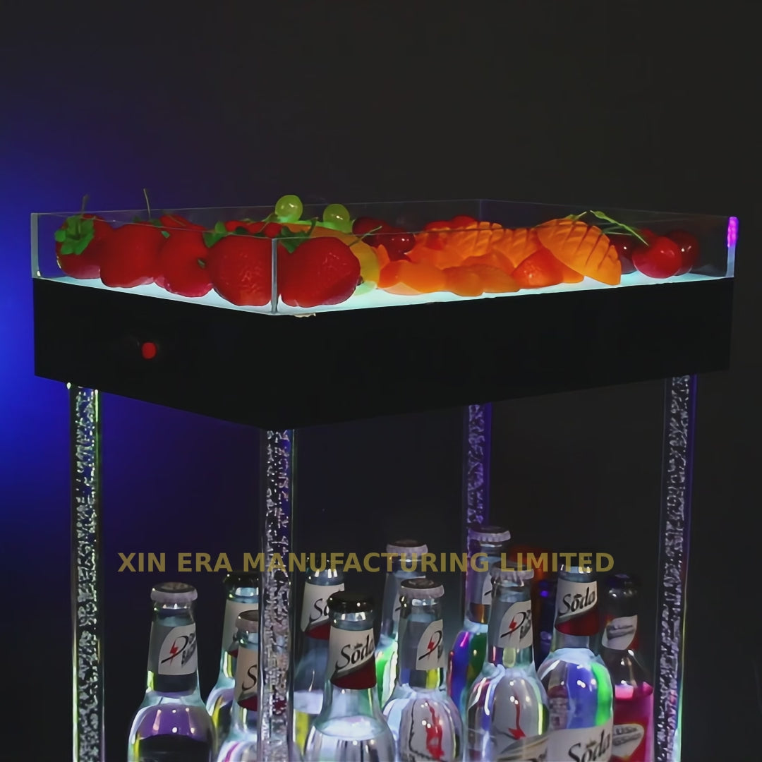 Luxury two-tier LED glowing presenter for bottles and fruit snacks, featuring illuminated crystal-filled pillars for premium nightclub VIP service.