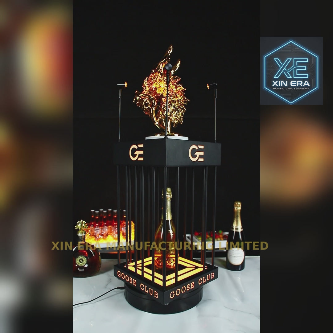Luxury gold dragon totem on LED illuminated bottle presenter.