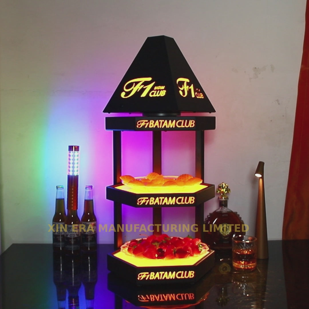 3-tier hexagonal LED display stand with matte black finish and illuminated acrylic base for commercial events
